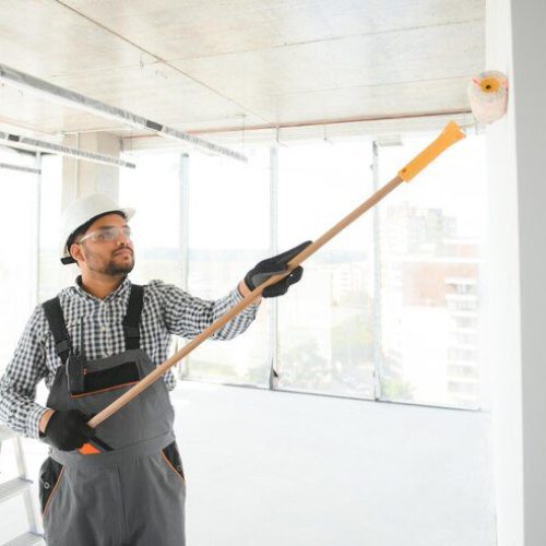 indian worker makes repairs apartment